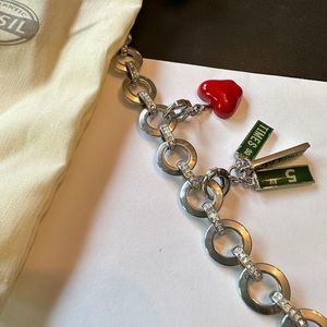 Fossil silver bracelet with rhinestones and two New York charms
